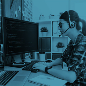 Woman on Computer with Headset