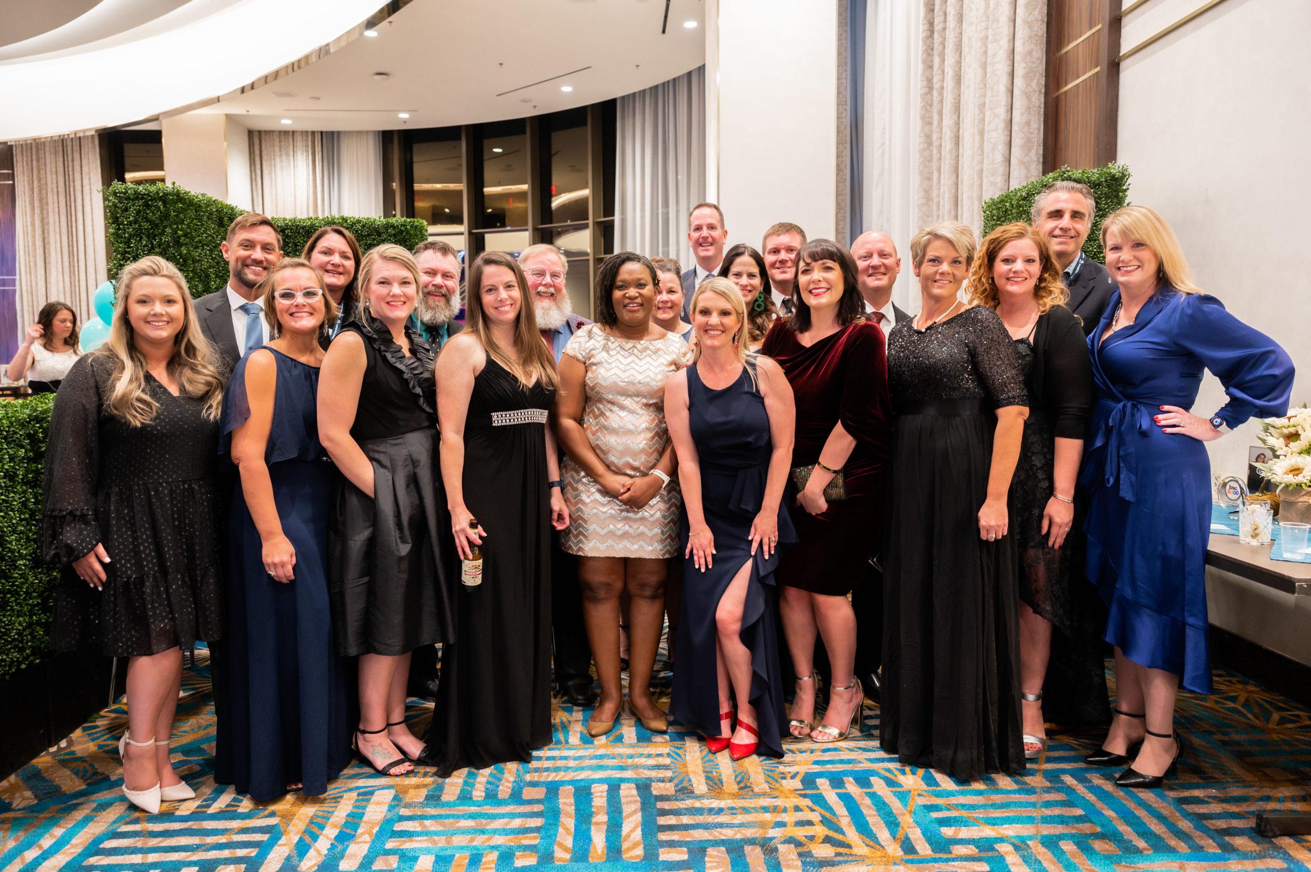 Liza Rodewald and Erica McMannes pose with Instant Teams employees at the MIGHTY 25 Gala at the Military Influencer Conference